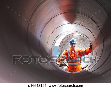 Man checking pipes View Large Photo Image Stock Image - Man checking pipes. Fotosearch