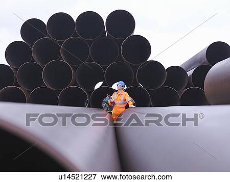 Man checking pipes View Large Photo Image Stock Photo - Man checking pipes. Fotosearch