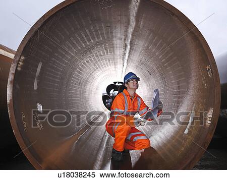 Man checking pipes View Large Photo Image Stock Photography - Man checking pipes. Fotosearch