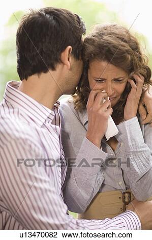Man consoling a woman View Large Photo Image Stock Image - Man consoling a woman. Fotosearch