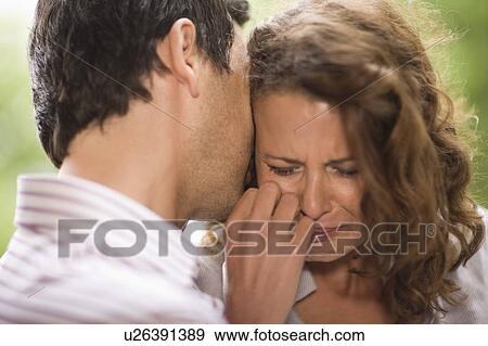 Man consoling a woman View Large Photo Image Stock Photo - Man consoling a woman. Fotosearch