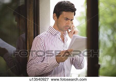 Stock Photo - Man doing a telephone call. Fotosearch