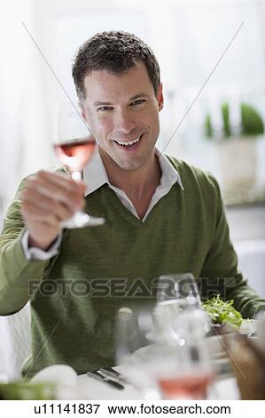 Man enjoying a glass of wine View Large Photo Image Stock Photo - Man enjoying a glass of wine. Fotosearch