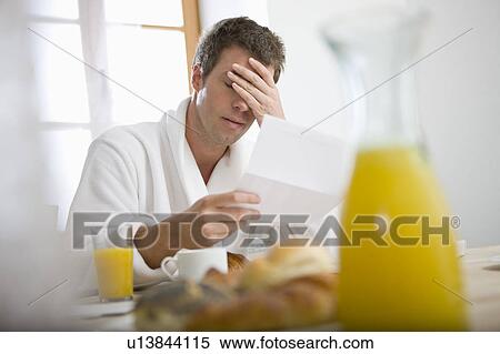 Stock Photography - Man getting bad news. Fotosearch