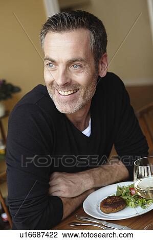 Man having dinner View Large Photo Image Stock Image - Man having dinner. Fotosearch