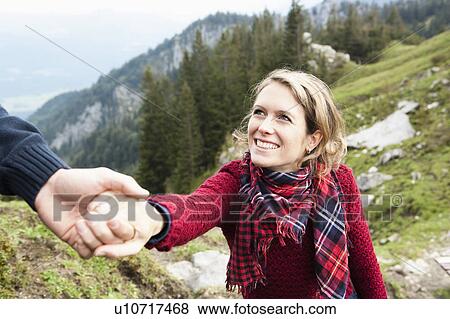 Man helping woman View Large Photo Image Stock Photo - Man helping woman. Fotosearch