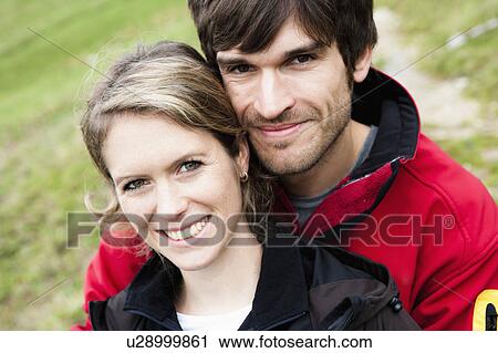 Man hugging girlfriend close-up View Large Photo Image Stock Image - Man hugging girlfriend close-up. Fotosearch