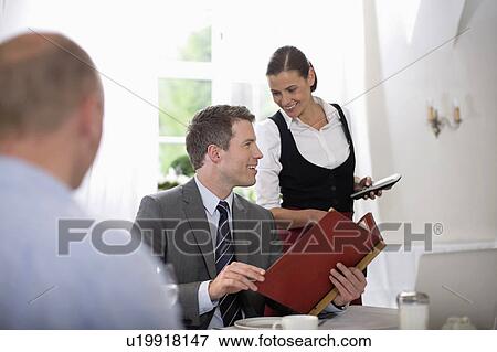 Stock Photo - Man in a restaurant. Fotosearch