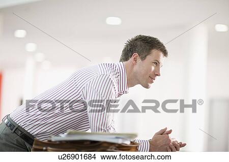 Man in an office View Large Photo Image Picture - Man in an office. Fotosearch