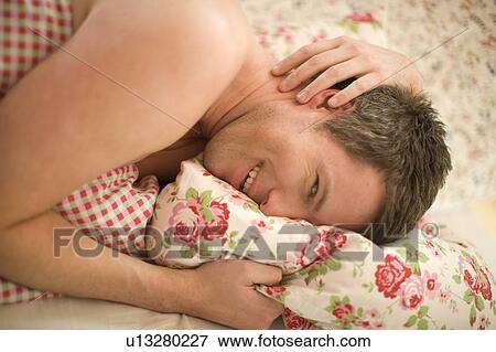 Man in bed View Large Photo Image Stock Photo - Man in bed. Fotosearch
