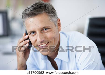 Man in office phoning View Large Photo Image Stock Image - Man in office phoning. Fotosearch