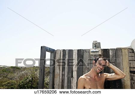 Man in shower in countryside View Large Photo Image Stock Photograph - Man in shower in countryside. Fotosearch