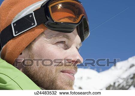 Man in winter landscape with ski goggles View Large Photo Image Stock Image - Man in winter landscape with ski goggles. Fotosearch