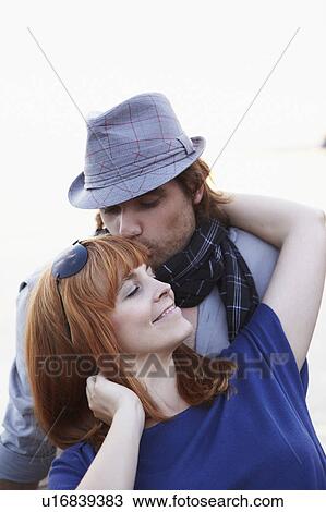 Man kissing woman to brow View Large Photo Image Stock Image - Man kissing woman to brow. Fotosearch