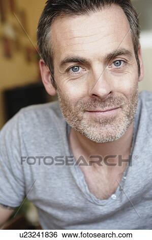 Stock Photograph - Man looking at camera close up. Fotosearch