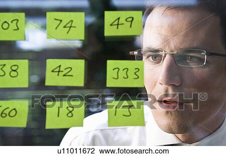 Man looks at yellow stickers View Large Photo Image Stock Image - Man looks at yellow stickers. Fotosearch