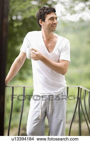 Man on a balcony View Large Photo Image Picture - Man on a balcony. Fotosearch