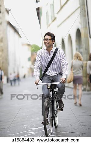 Man on a bike View Large Photo Image Stock Image - Man on a bike. Fotosearch