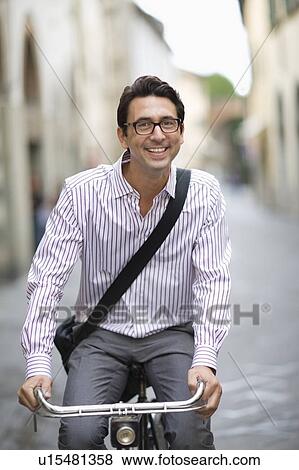 Stock Photo - Man on a bike. Fotosearch