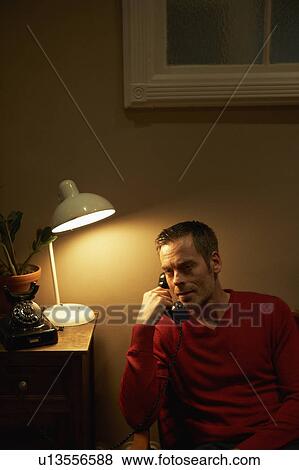 Man phoning with vintage phone View Large Photo Image Stock Photo - Man phoning with vintage phone. Fotosearch