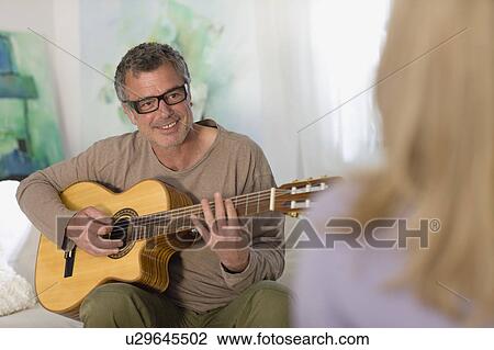 Man playing guitar View Large Photo Image Stock Image - Man playing guitar. Fotosearch