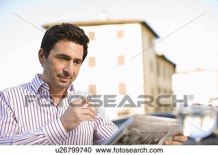 Man reading a newspaper View Large Photo Image Stock Image - Man reading a newspaper. Fotosearch