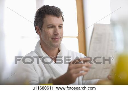 Stock Image - Man reading newspaper. Fotosearch