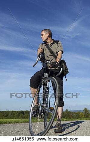 standing on a bike