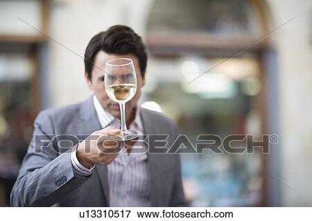 Stock Photo - Man tasting whine. Fotosearch