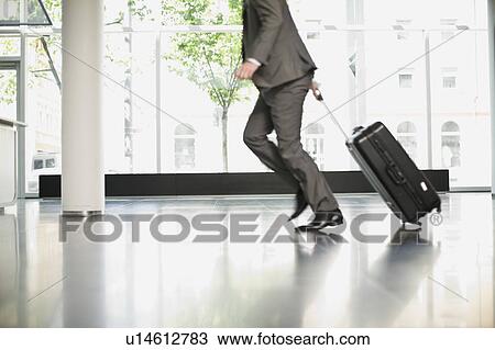 Man trying to catch his flight View Large Photo Image Stock Image - Man trying to catch his flight. Fotosearch