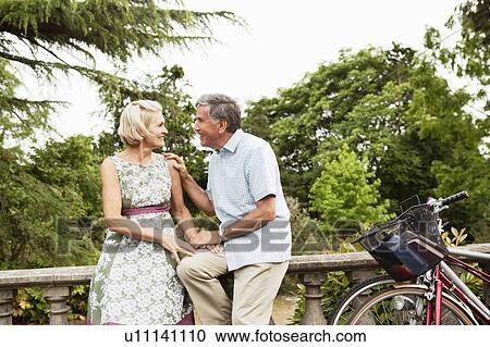 Mature couple having a romantic break View Large Photo Image Stock Image - Mature couple having a romantic break. Fotosearch