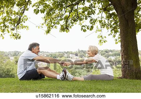 Mature couple stretching eachother View Large Photo Image Stock Photograph - Mature couple stretching eachother. Fotosearch