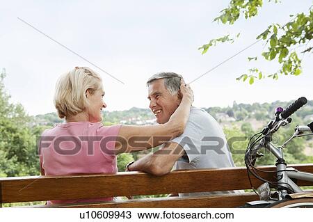 Mature woman embraces partner View Large Photo Image Stock Image - Mature woman embraces partner. Fotosearch