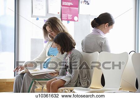 Mother and child in doctor waiting room View Large Photo Image Stock Image - Mother and child in doctor waiting room. Fotosearch