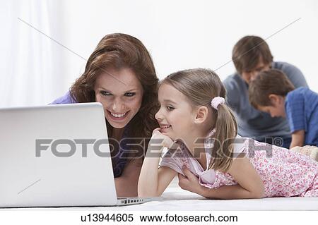 Mother and daughter on laptop View Large Photo Image Stock Photography - Mother and daughter on laptop. Fotosearch