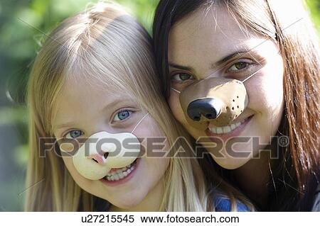 Mother and daughter wearing masks View Large Photo Image Stock Photography - Mother and daughter wearing masks. Fotosearch