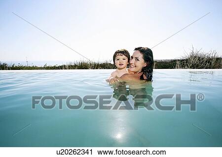 Mother with baby boy in swimming pool View Large Photo Image Stock Image - Mother with baby boy in swimming pool. Fotosearch