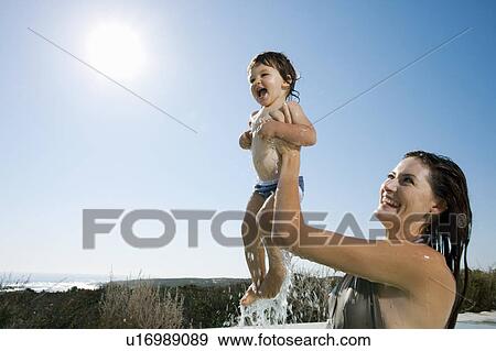 Mother with baby boy in swimming pool View Large Photo Image Stock Photo - Mother with baby boy in swimming pool. Fotosearch