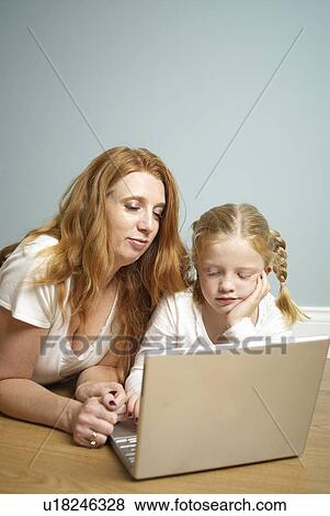 Mum and daughter on computer View Large Photo Image Stock Photo - Mum and daughter on computer. Fotosearch