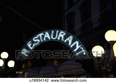 Stock Image - Neon Restaurant sign at night. Fotosearch