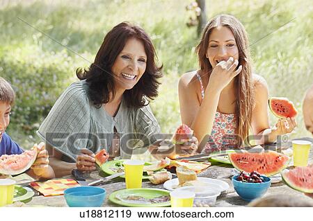 Older woman with daughter at picnic View Large Photo Image Stock Photo - Older woman with daughter at picnic. Fotosearch
