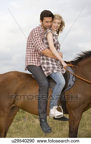 Stock Image - People and horses. Fotosearch