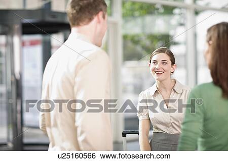 Stock Photograph - People meeting at an airport. Fotosearch