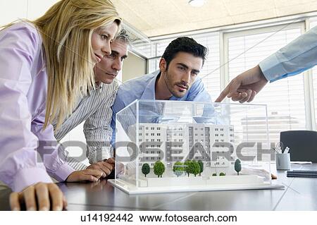 People studying architectural model View Large Photo Image Stock Image - People studying architectural model. Fotosearch