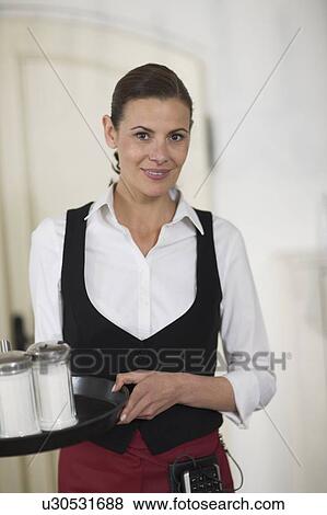 Portrait of a waitress View Large Photo Image Stock Photo - Portrait of a waitress. Fotosearch