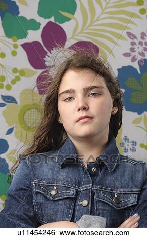 Portrait of girl with flower wallpaper View Large Photo Image Stock Photograph - Portrait of girl with flower wallpaper. Fotosearch