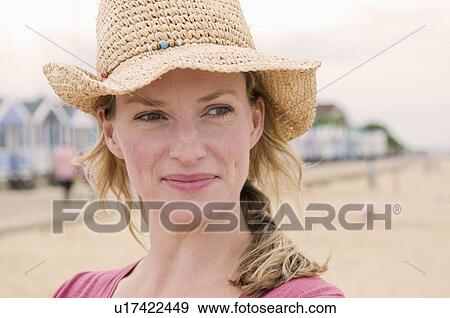 Stock Photo - Portrait of happy women on beach. Fotosearch