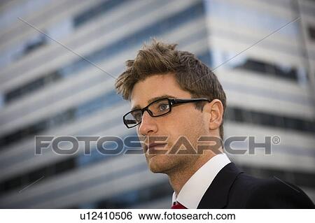 Stock Photograph - Portrait of man in city. Fotosearch
