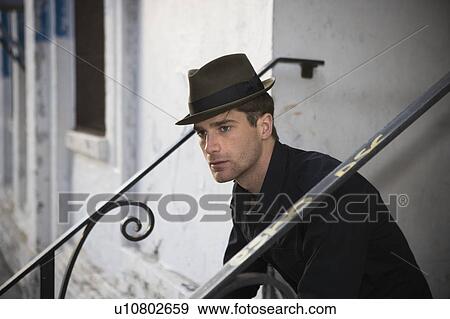Portrait of man sitting on steps View Large Photo Image Stock Photo - Portrait of man sitting on steps. Fotosearch