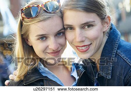 Portrait of two women, smiling View Large Photo Image Stock Image - Portrait of two women, smiling. Fotosearch